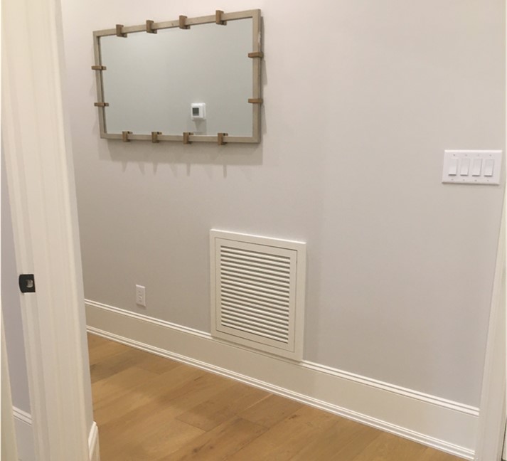 Thanks to one of our friends in North Carolina for the great photo of this Wood Return Air Filter Grille from WoodAirGrille.com installed in the hallway of a beautiful luxury home.